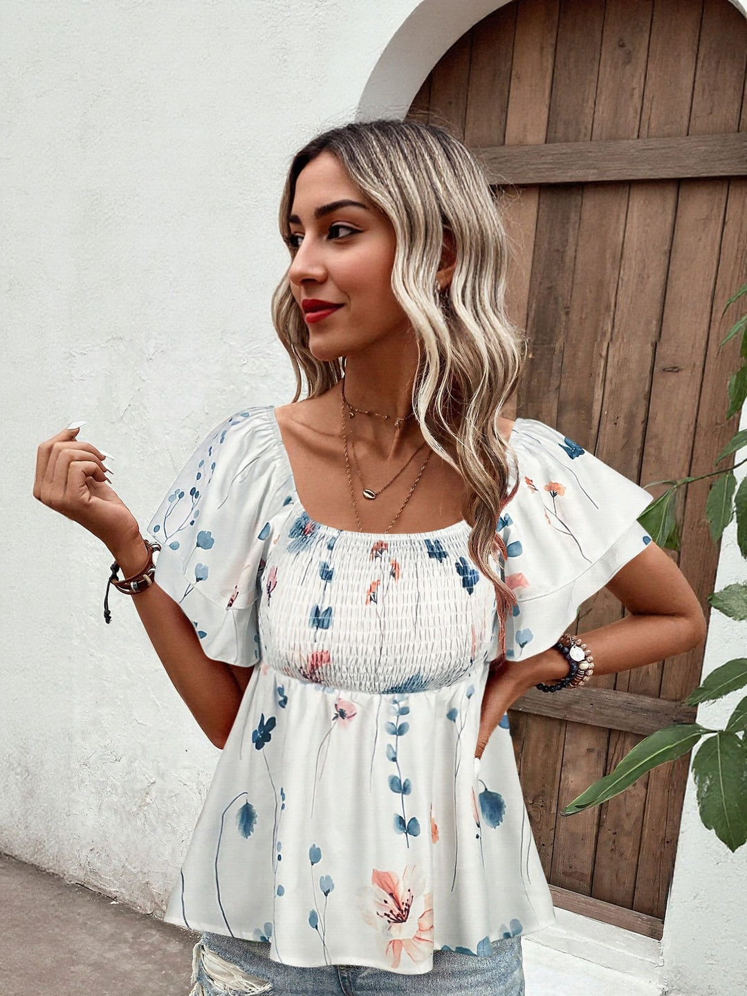 White Top With Flared Sleeve And Smocking Detail