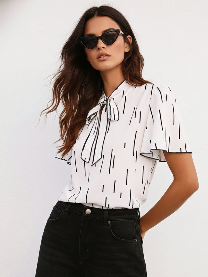 White Flutter Sleeved Printed Blouse