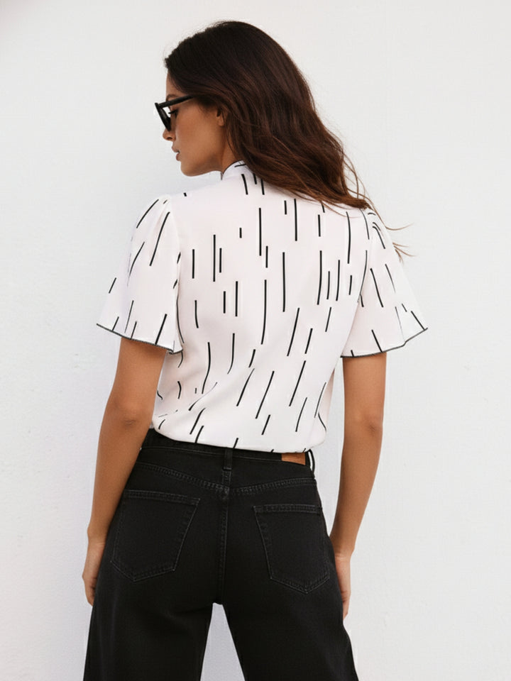 White Flutter Sleeved Printed Blouse