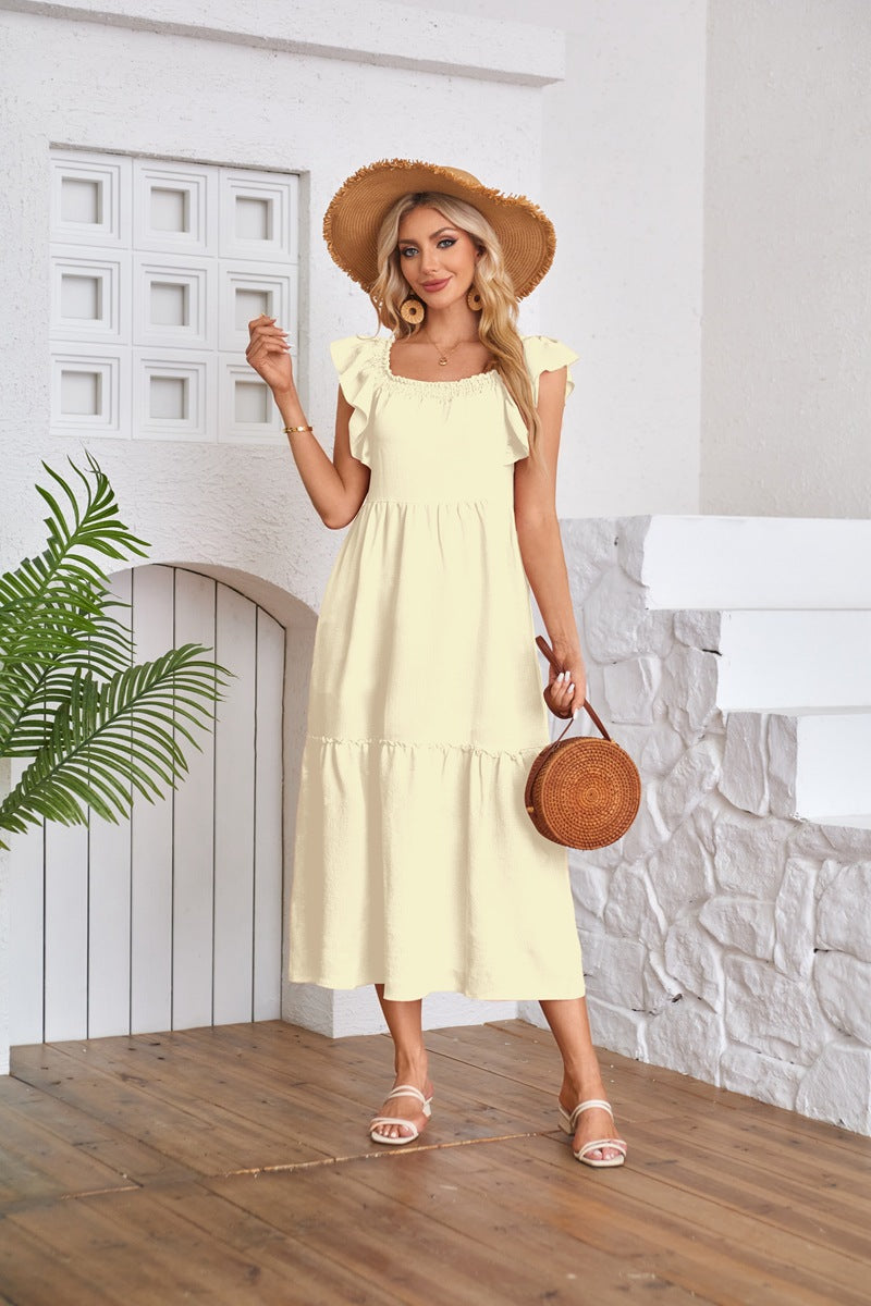 Yellow Solid Flutter Sleeved Empire Waist Smocked Dress