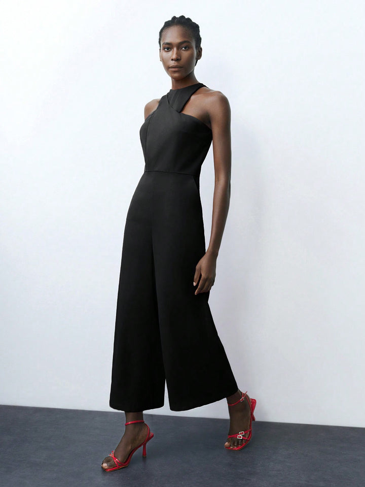 Black Cropped Jumpsuit With Square Cut Armhole Detail.