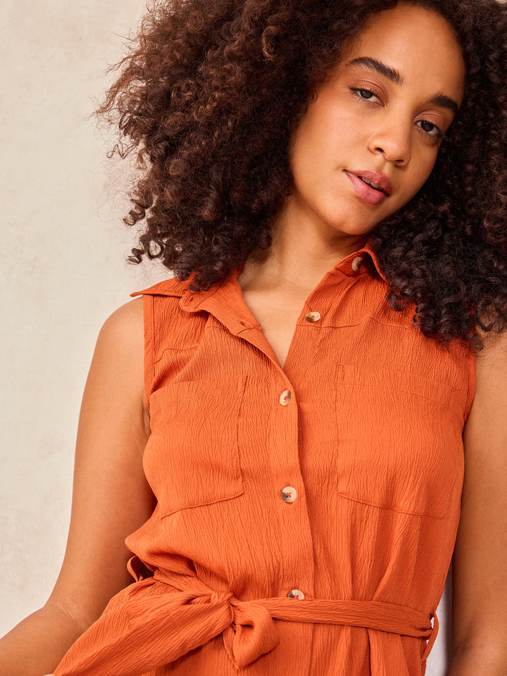 Rust Sleeveless Shirt With Pocket And Tie Up Detail