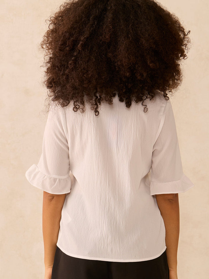 White Front Buttoned Top With Ruffle Detail On Sleeve