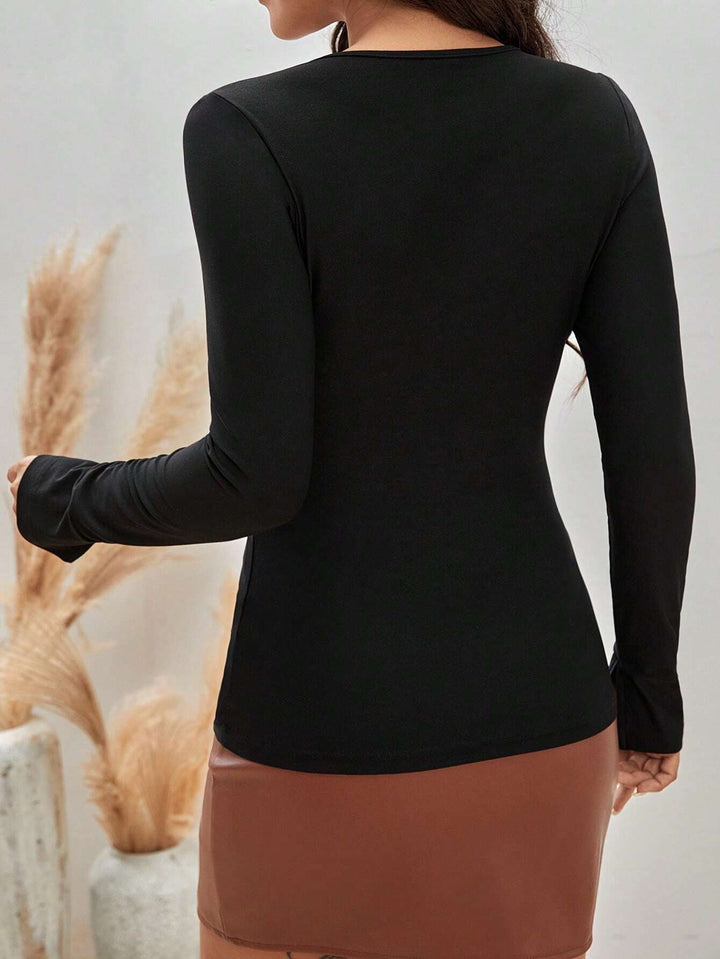 Black Plunge Neck With Metal Trim Strap Top