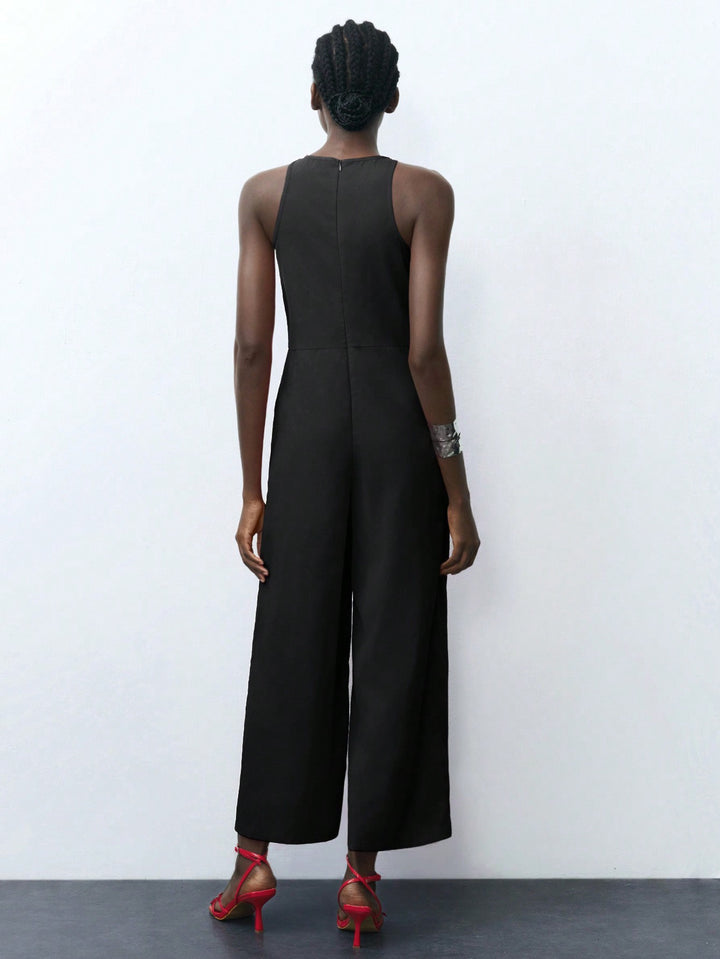 Black Cropped Jumpsuit With Square Cut Armhole Detail.