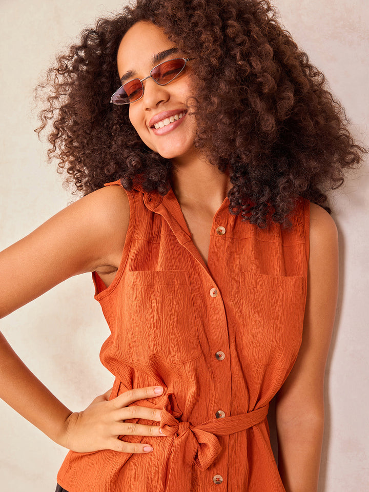 Rust Sleeveless Shirt With Pocket And Tie Up Detail